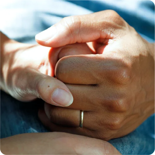 Doctor and patient holding hands